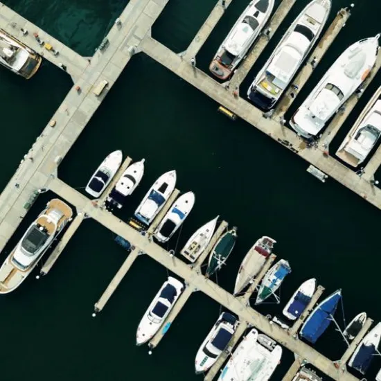 Yachts moored along the pontoons of the private marina