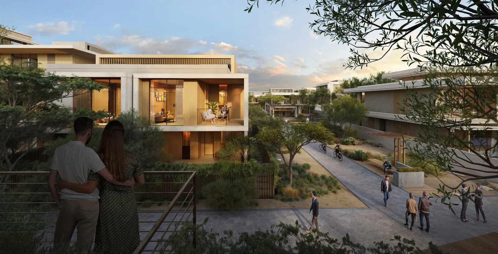 Residents walking along a Sikka townhouse lane